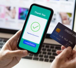 A person holds a phone with 'Payment Successful,' showcasing advanced POS payment gateway.