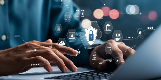 Hands typing on a laptop with digital lock icons, showcasing payment gateway solutions.