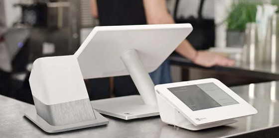 A Clover POS system with touchscreen and card reader showcases modern payment solutions.