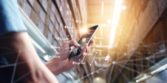 Warehouse with smartphone and icons for POS, payment solutions, and processing.