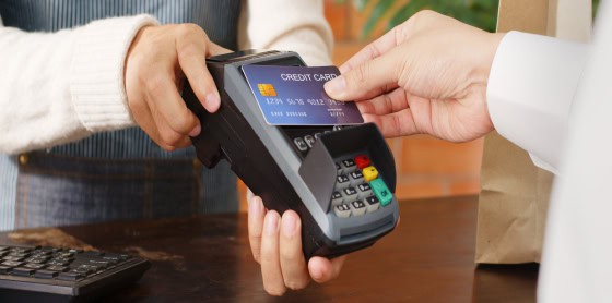 A POS system facilitates credit card payment processing held by a merchant.