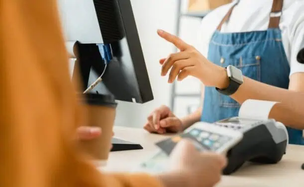 Business owner runs customer credit card transaction.