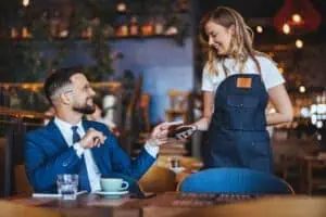 Business person uses a credit card as a payment method