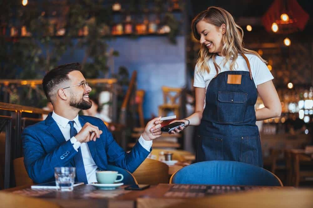 Business person uses a credit card as a payment method