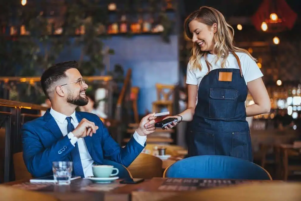 Business person uses a credit card as a payment method