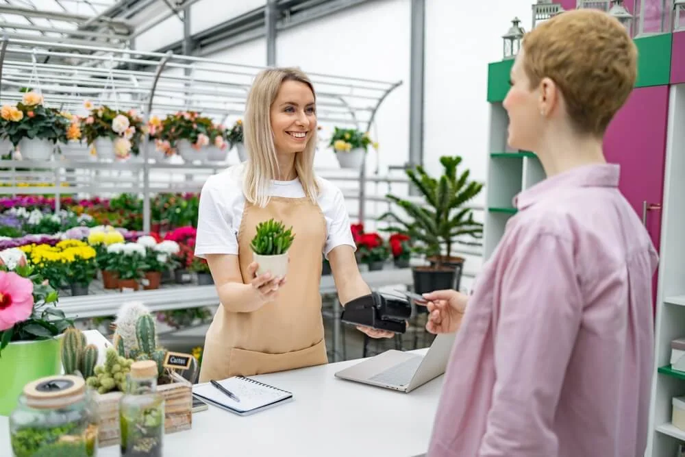 A customer purchases a plant from a small business.